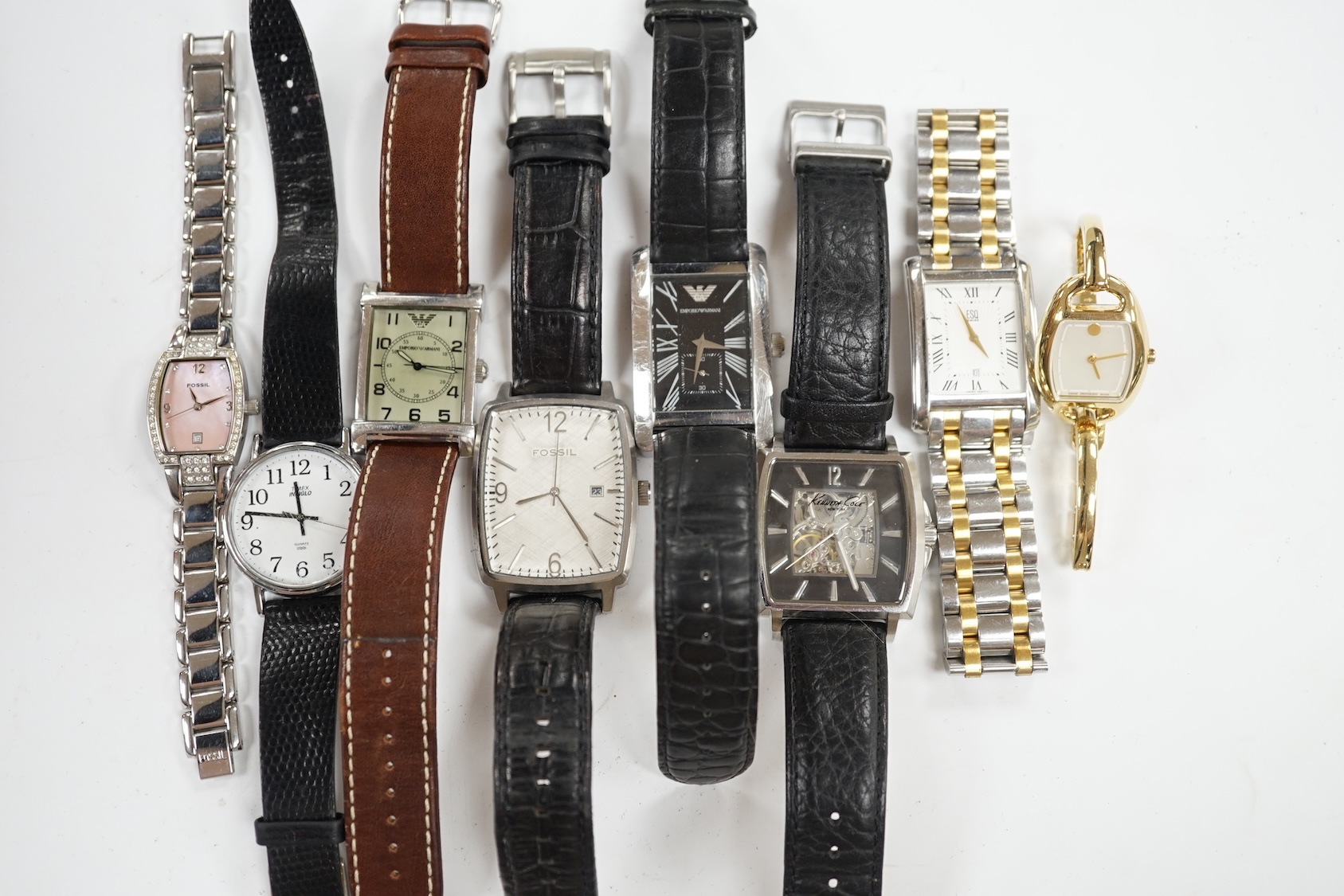 Eight assorted lady's and gentleman's modern wrist watches including Emporio Armani, Esq and Fossil. Condition - poor to fair